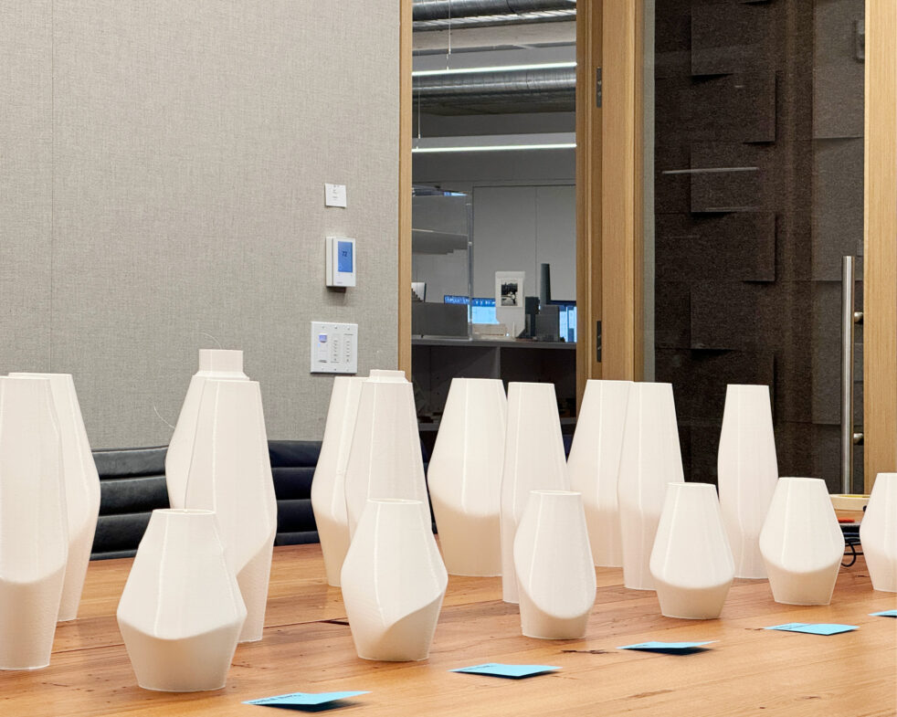 Architecture Research Office Series Light Pendants. White pendant mock-ups on a table.