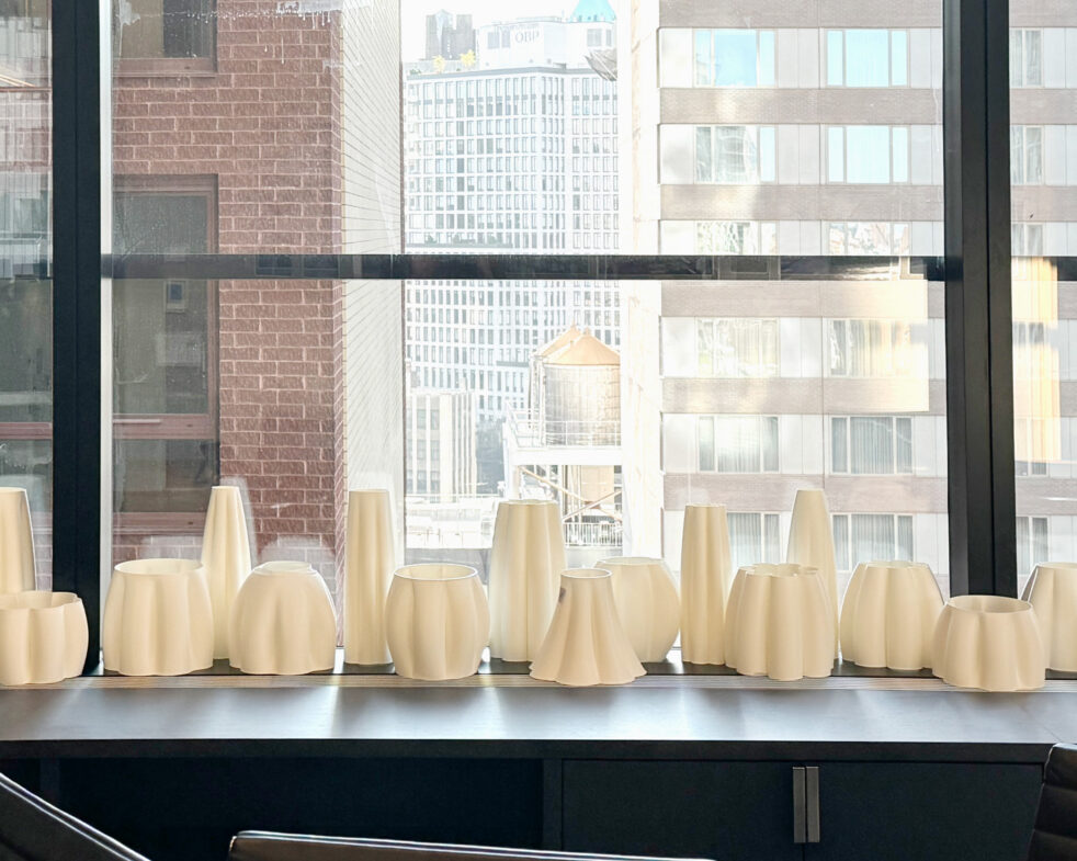 Architecture Research Office Series Light Pendants. White pendant mock-ups in front of a window.